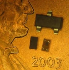 Orient Display Glossary: Top and bottom of a WL-CSP package sitting on the face of a U.S. penny
