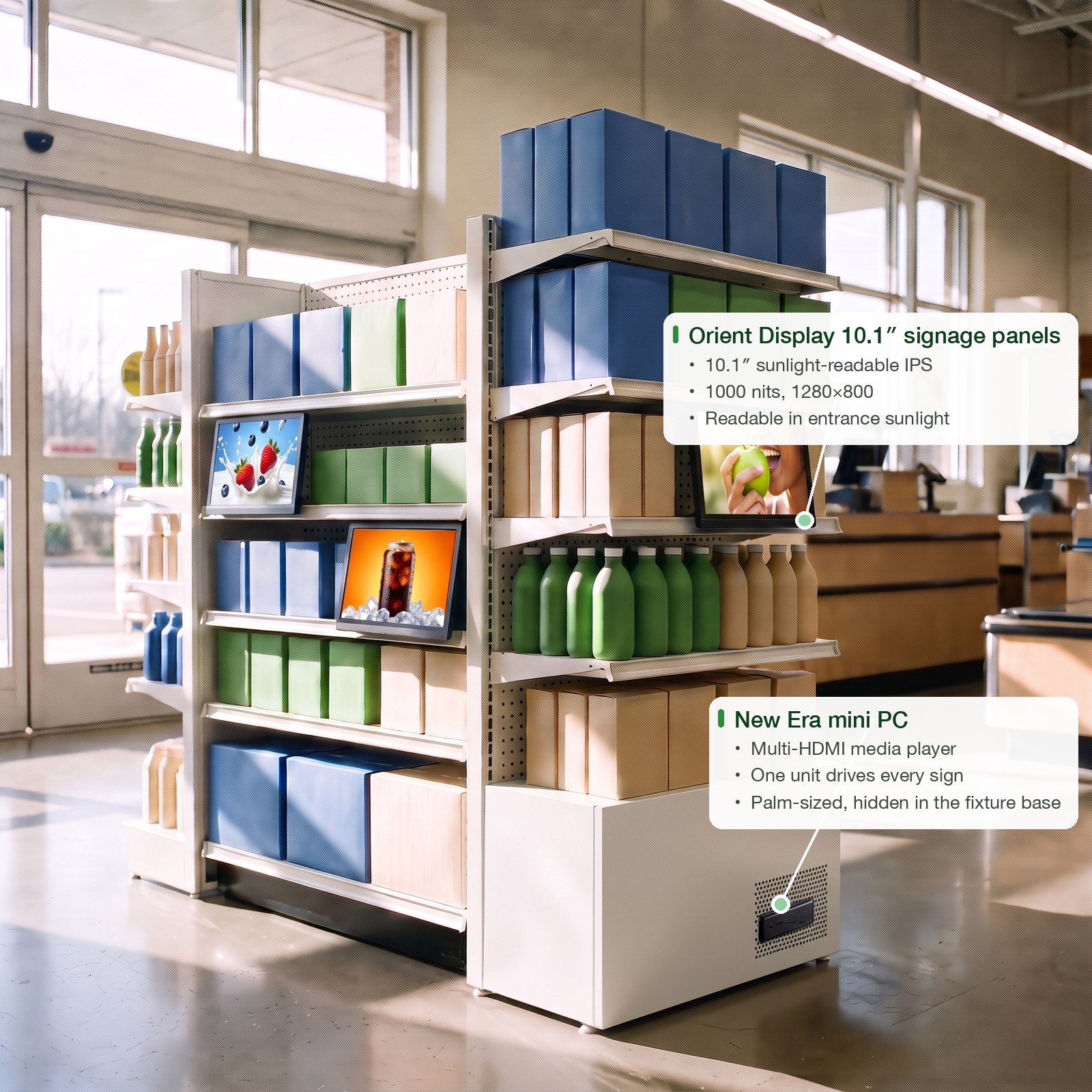 Digital signage: three 10.1″ sunlight-readable Orient Display ad screens built into a grocery endcap by the sunlit entrance, all driven by one small New Era mini PC hidden in the fixture base